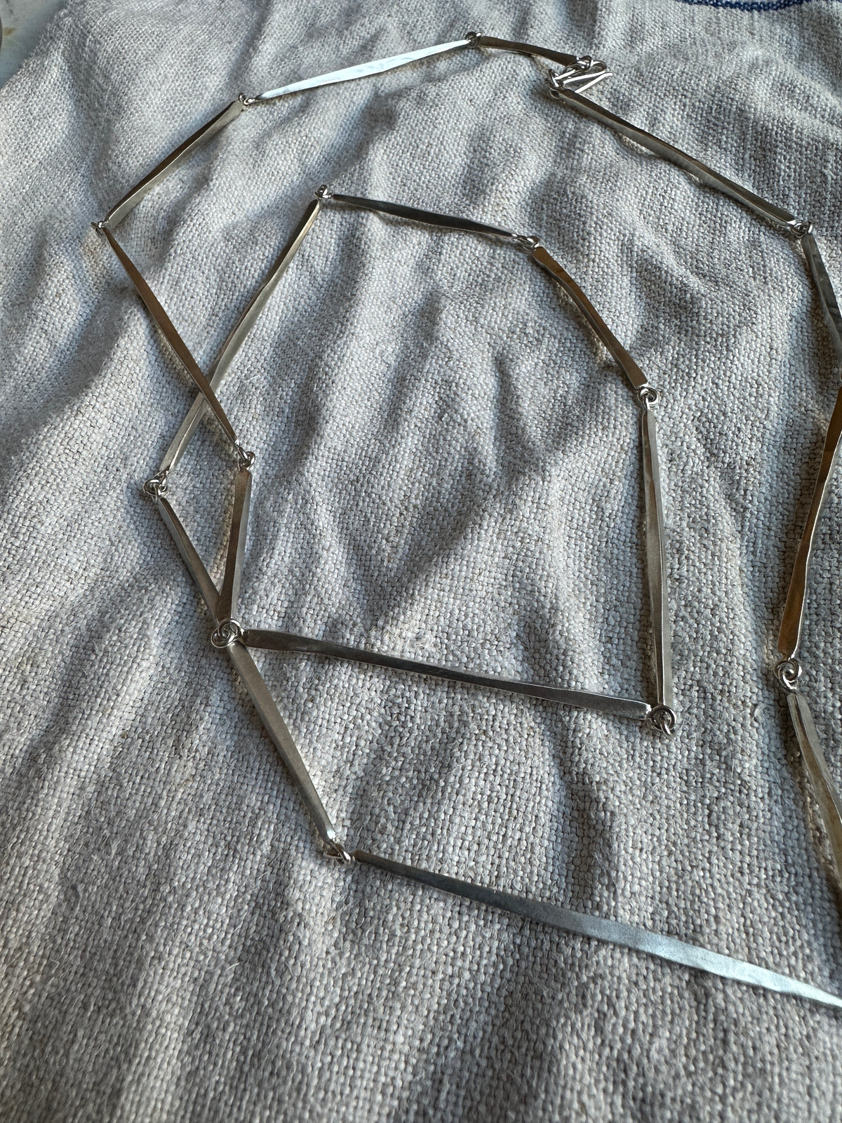 Silver long linear hammered necklace