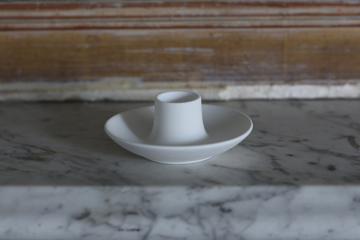 White Candle Holder on Marble