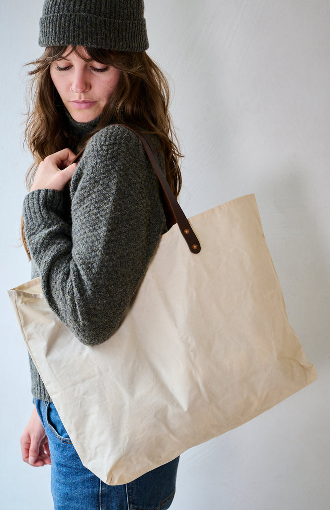 Waxed cotton cream bag by Freight, worn with Freight jumper