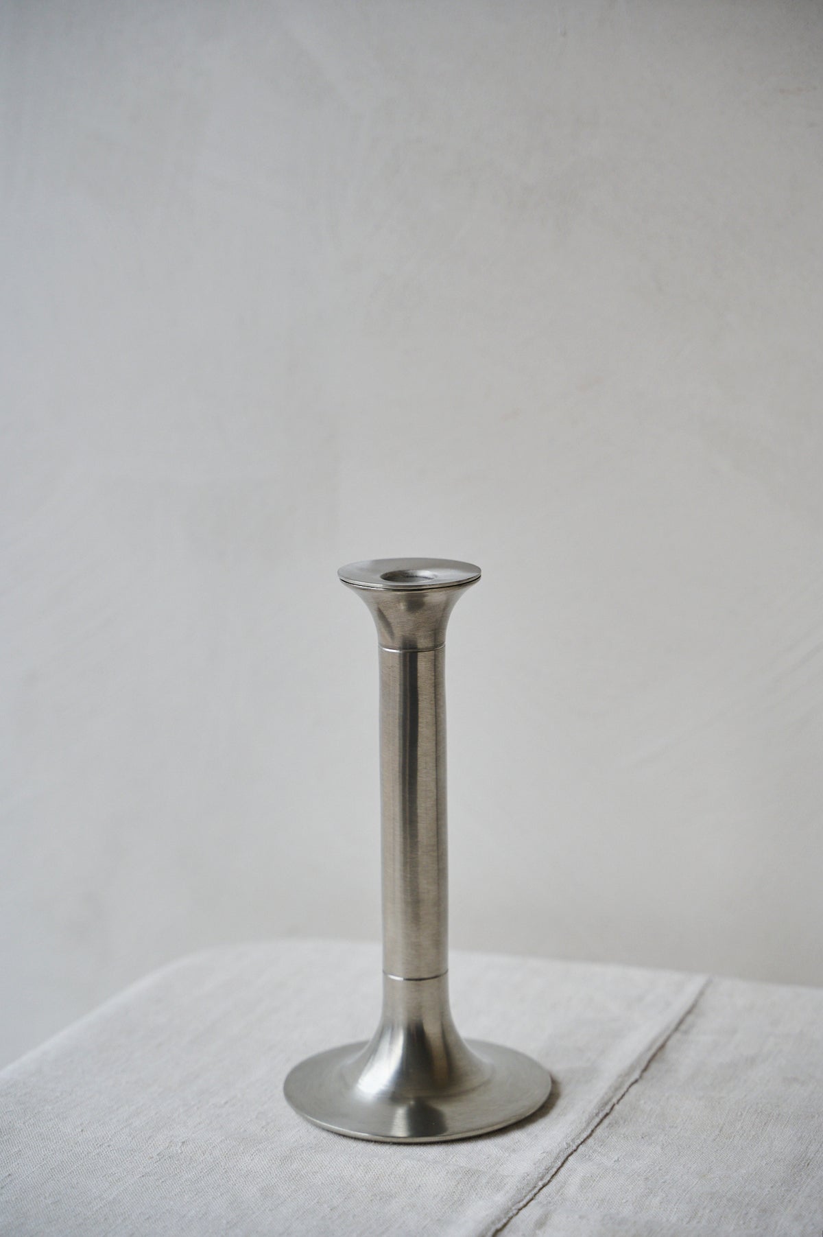 Medium pewter candlestick in chrome finish with two grooves