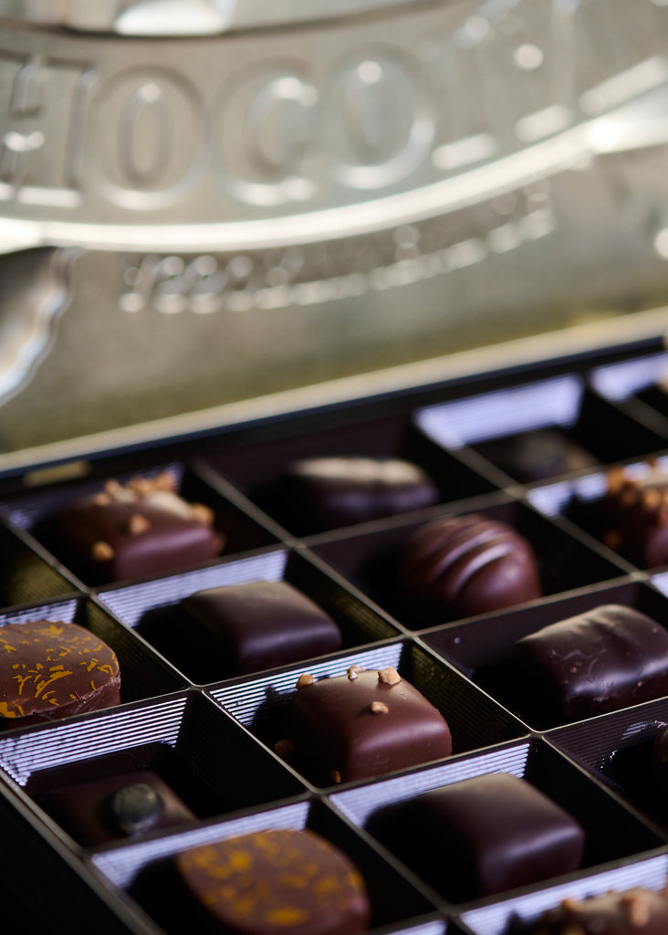 Large selection of chocolate pralines In a traditional Tin