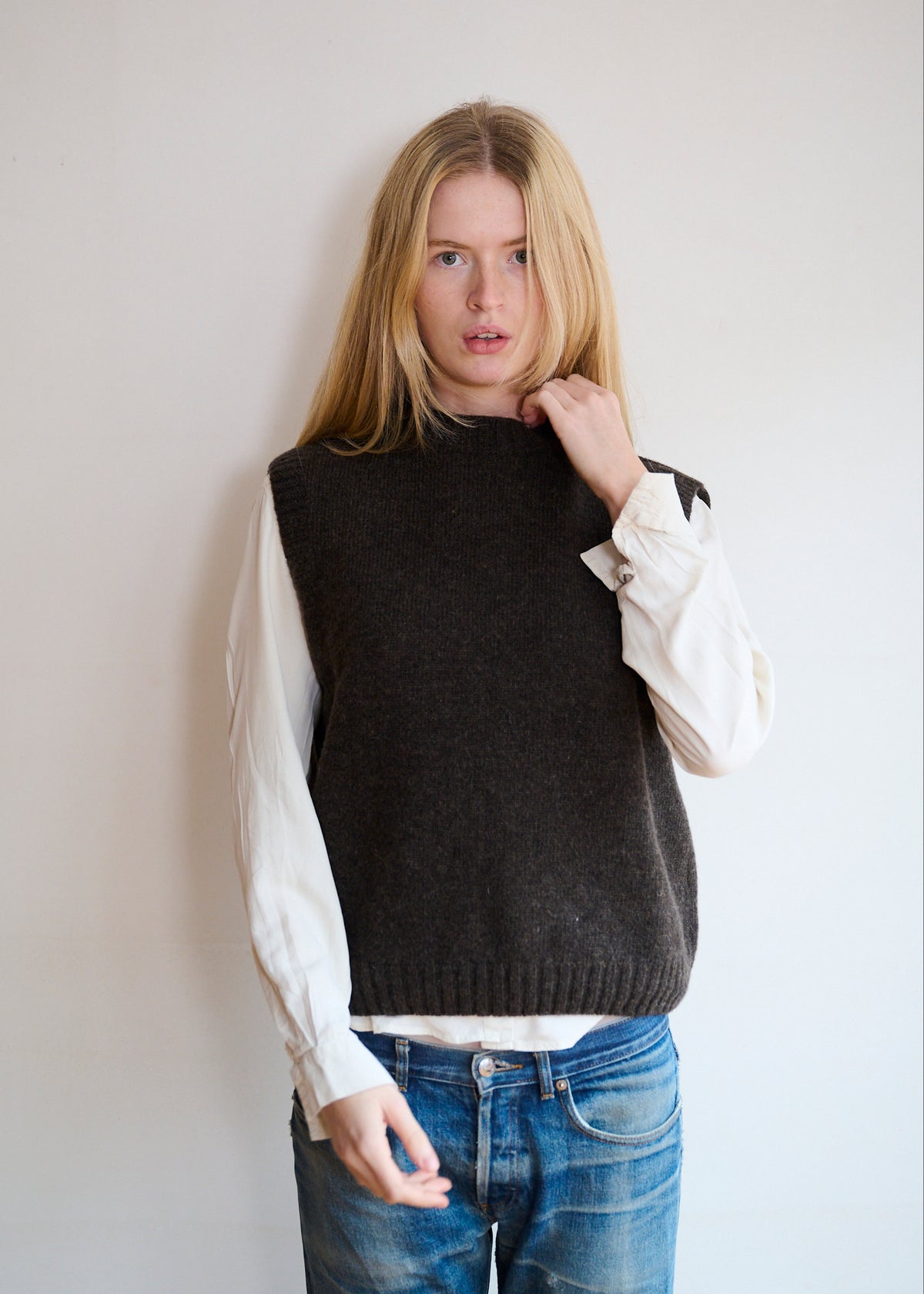 Dark brown pure lambswool knitted tank work over a sandwashed silk cream shirt