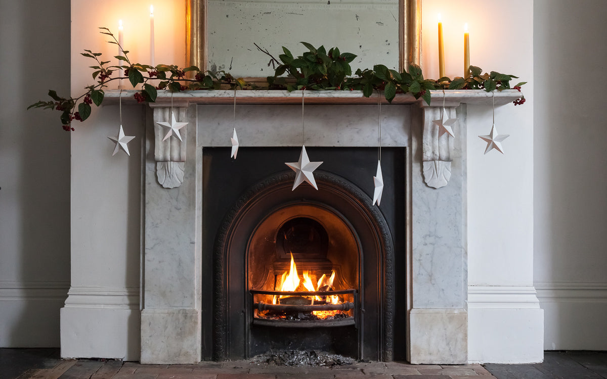 Bone China White Star Decorations on Mantlepiece 