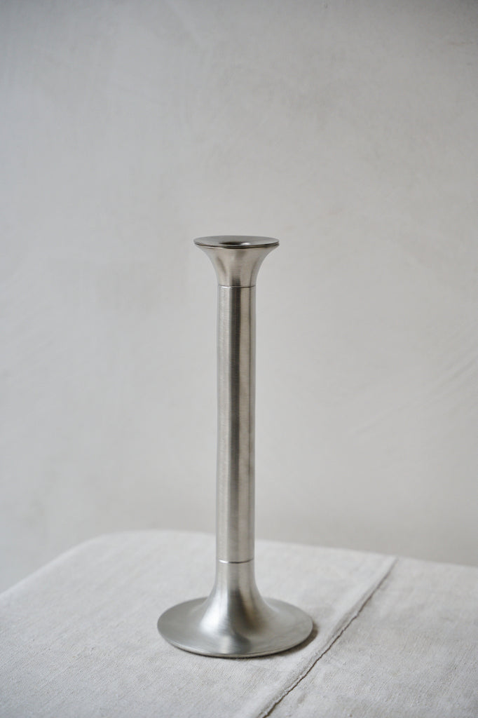 Tall pewter candlestick in a chrome finish with two grooves