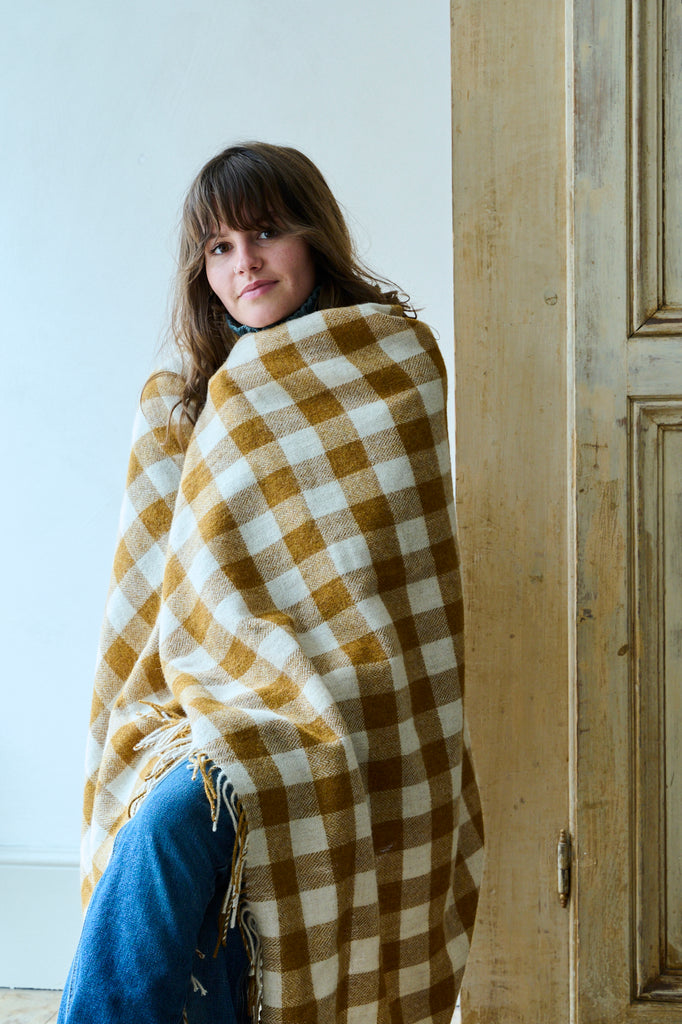 Gingham blanket worn as a shawl, and made from lambswool