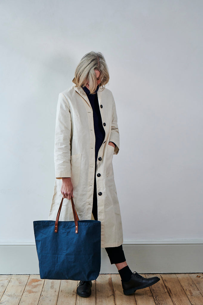 Blue bag with brown leather straps, designed by Freight and made in the UK