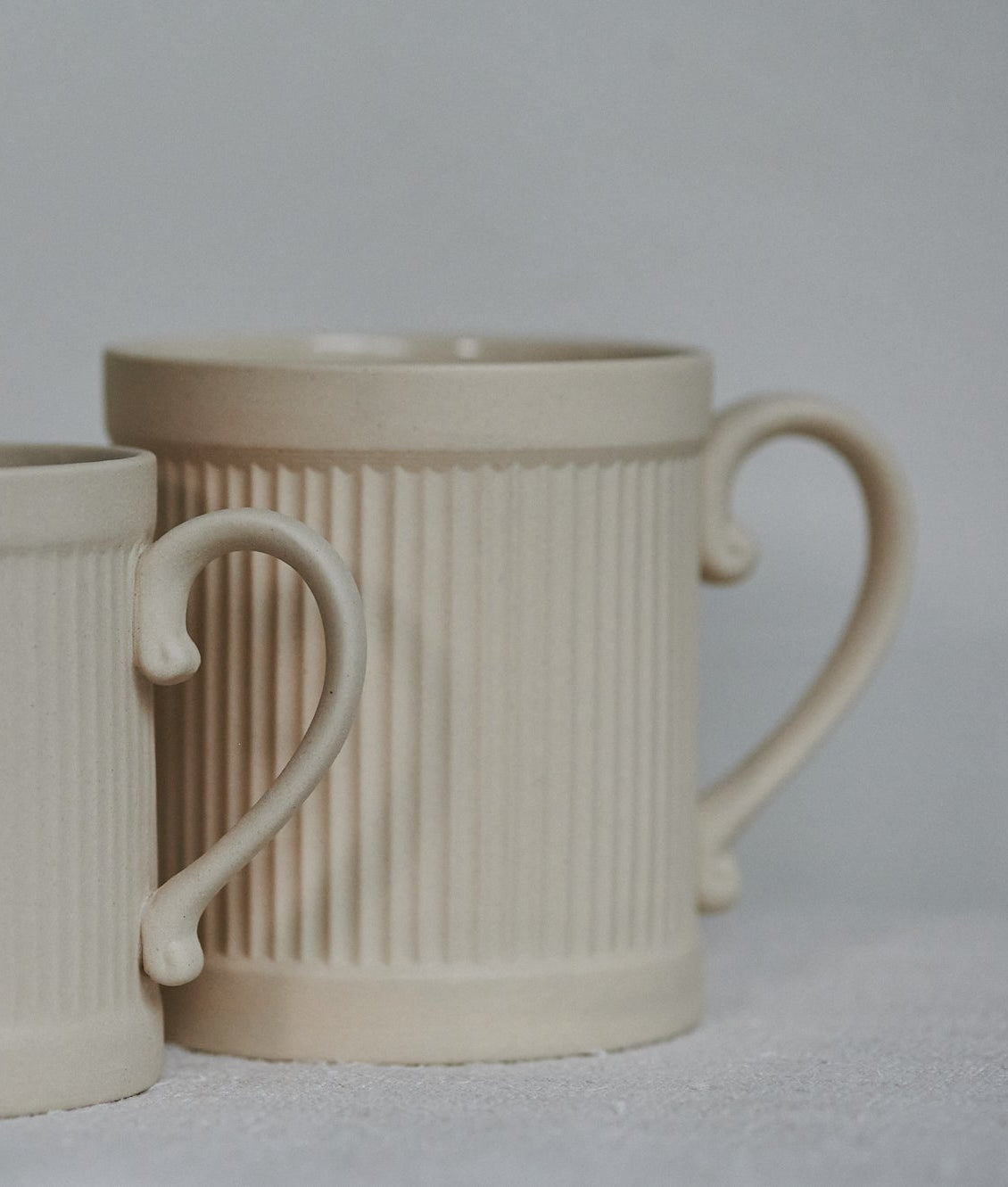 Stoneware coffee mug on the left, Tea mug on the right