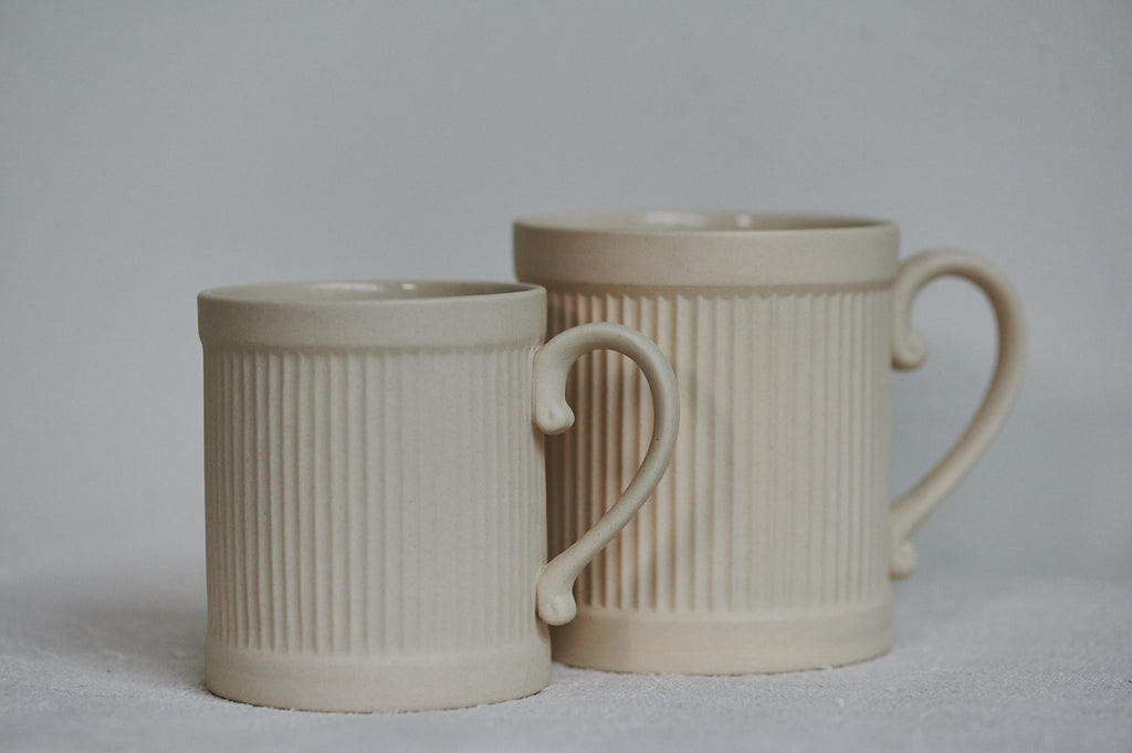 Stoneware coffee mug on the left, Tea mug on the right