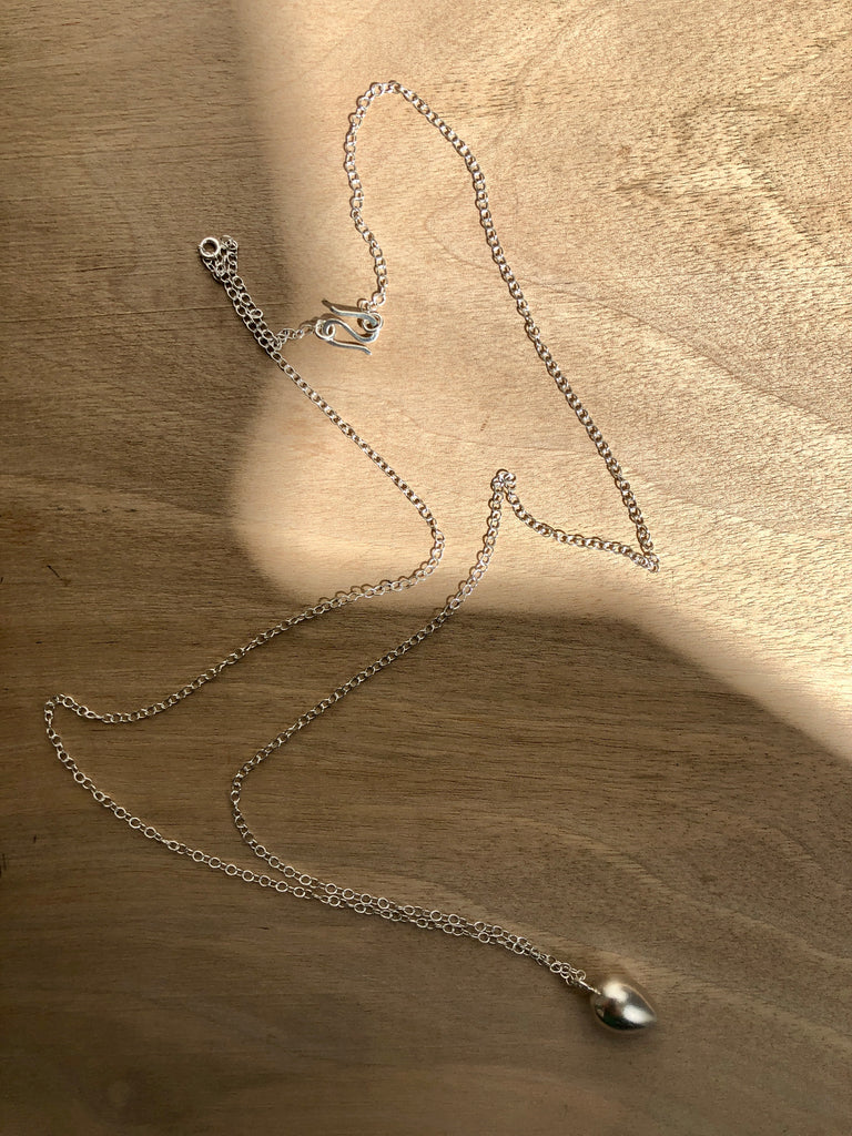 Silver necklace with 26 inch chain and solid silver egg pendant