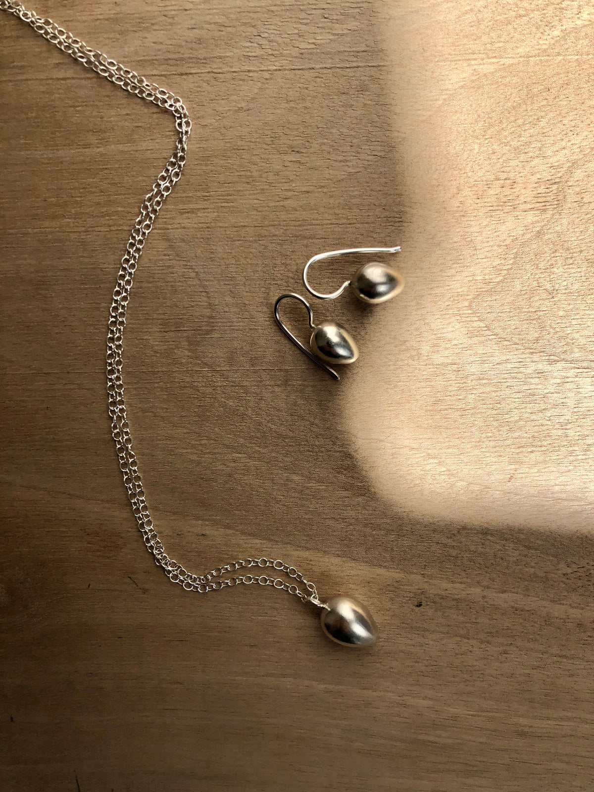 Silver egg earrings